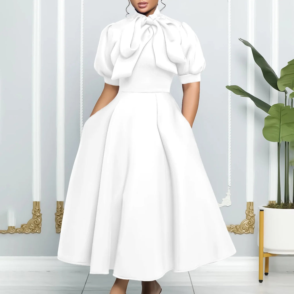 👑 QUEEN BOW — ROBE PLISSÉE À NŒUD SIGNATURE