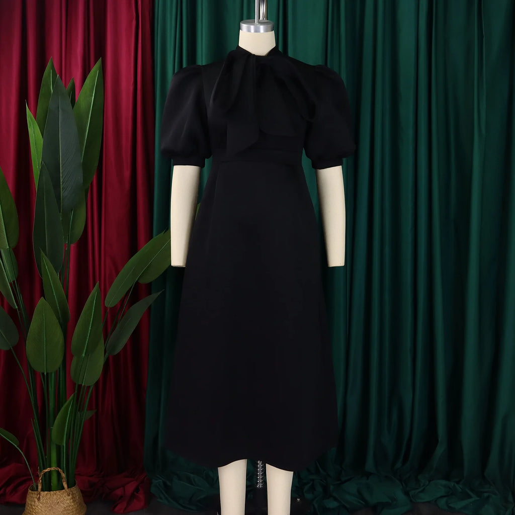 👑 QUEEN BOW — ROBE PLISSÉE À NŒUD SIGNATURE