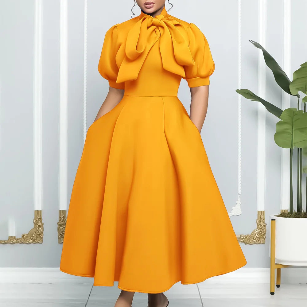 👑 QUEEN BOW — ROBE PLISSÉE À NŒUD SIGNATURE
