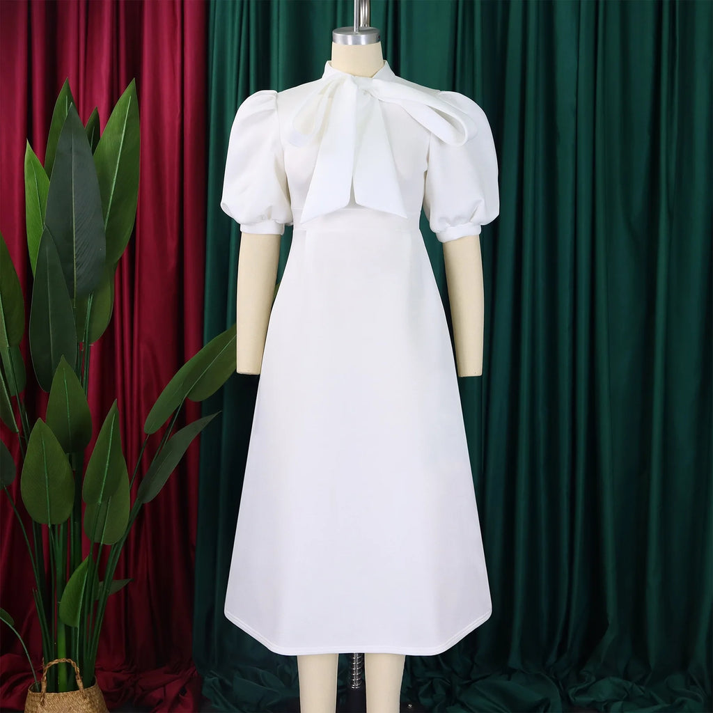 👑 QUEEN BOW — ROBE PLISSÉE À NŒUD SIGNATURE