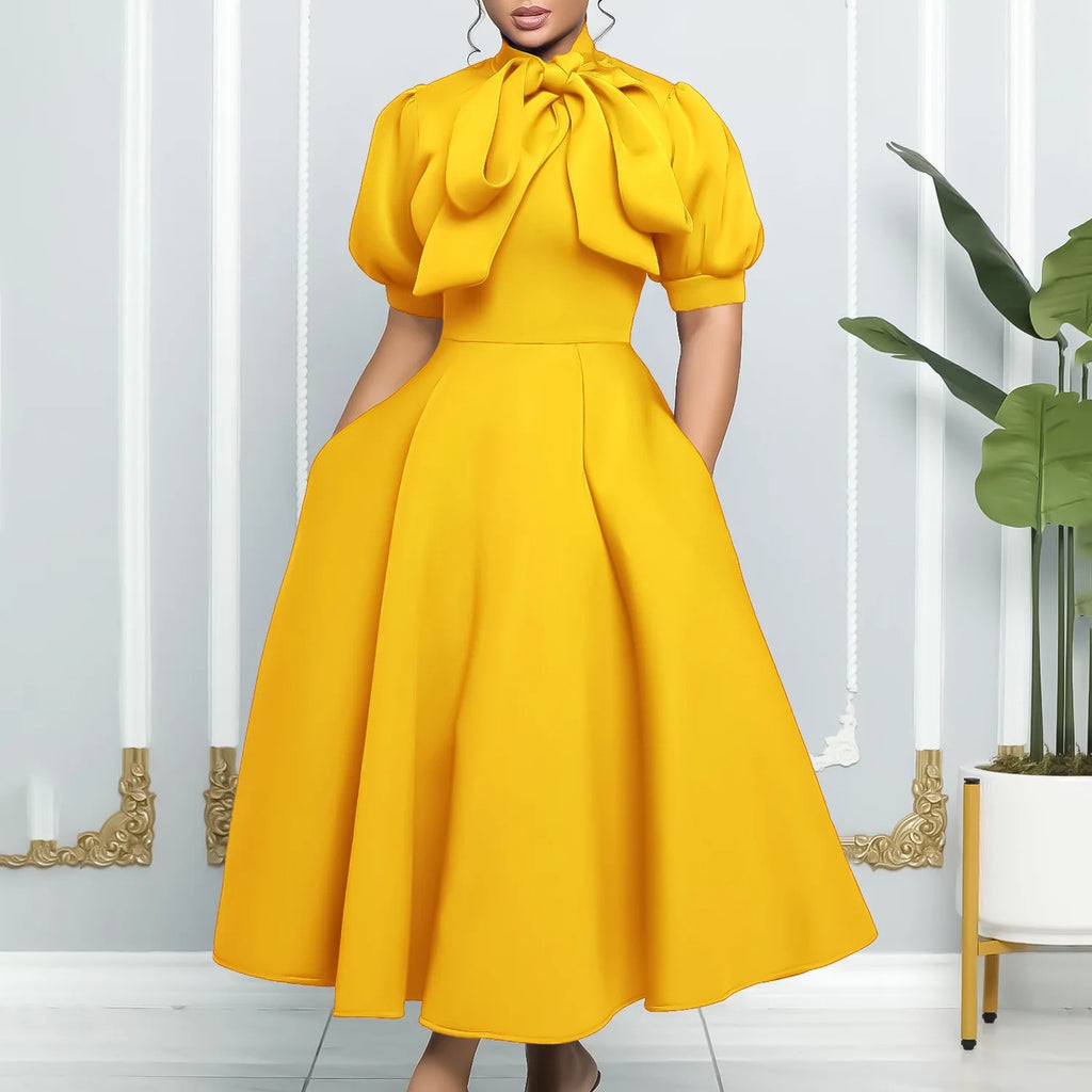 👑 QUEEN BOW — ROBE PLISSÉE À NŒUD SIGNATURE